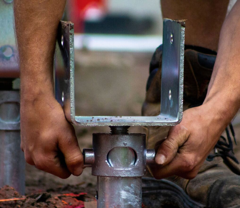 Person who drill a screw piles